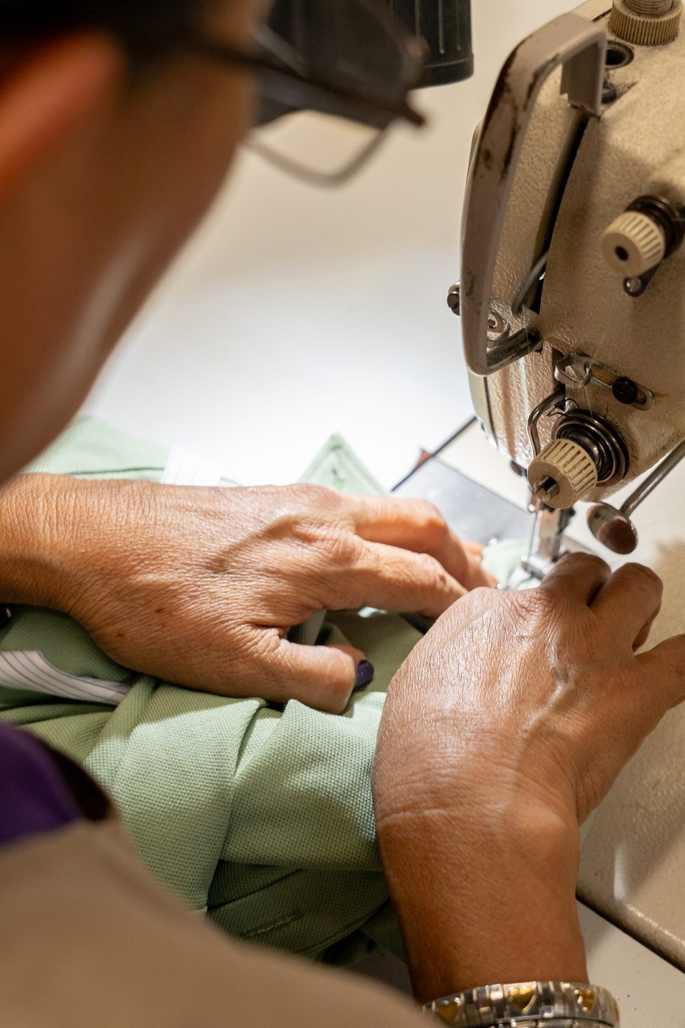 Seamstress sewing a premium shirt on an industrial machine at Grupo Manchester's factory in Monterrey, Mexico