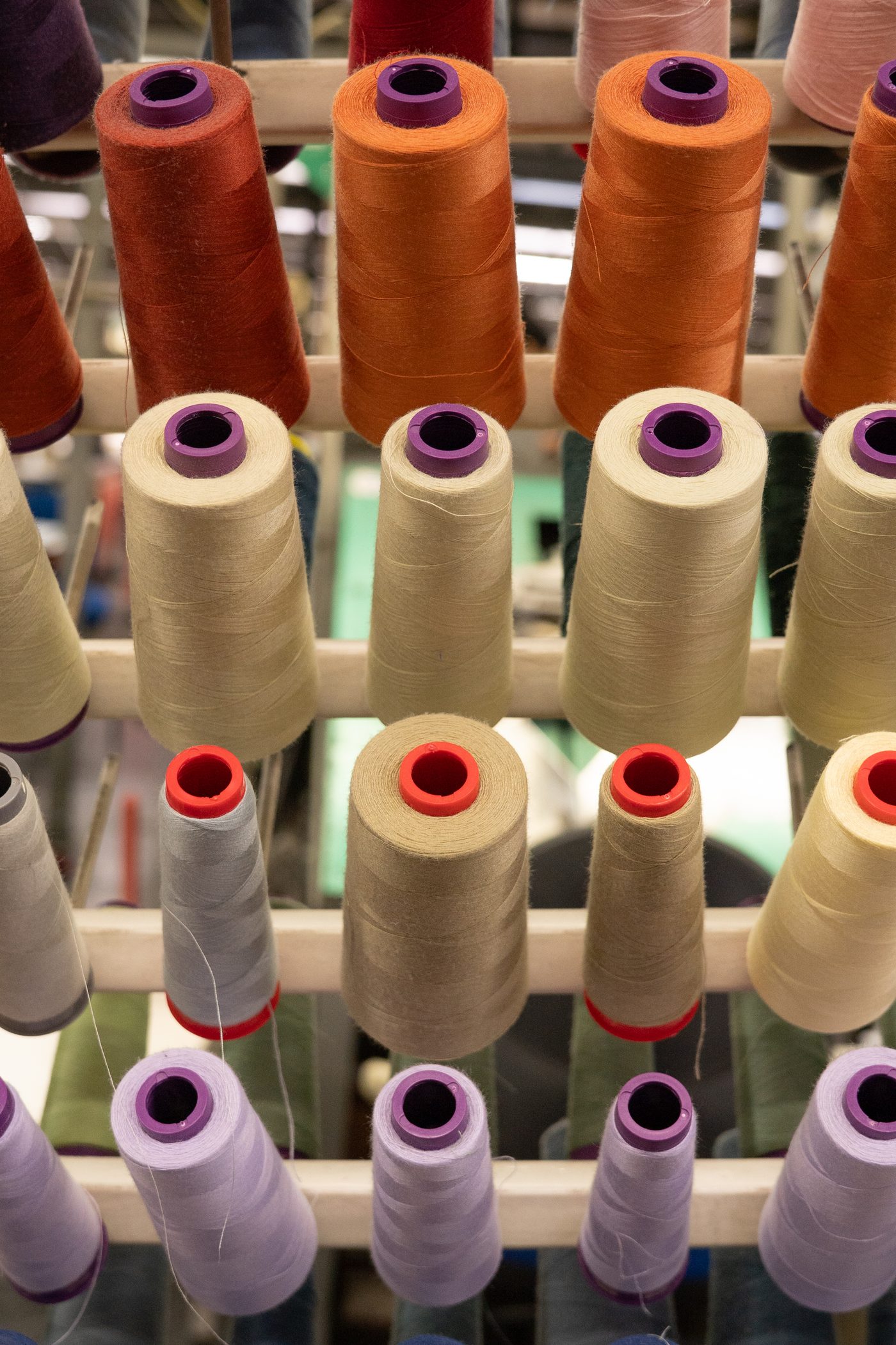 Racks of thread spools in every color inside Grupo Manchester's textile factory in Monterrey, Mexico